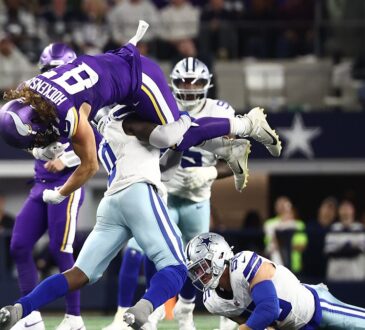 Dallas Cowboys linebacker DeMarvion Overshown flips Minnesota Vikings tight end T.J. Hockenson upside down on a tackle.
