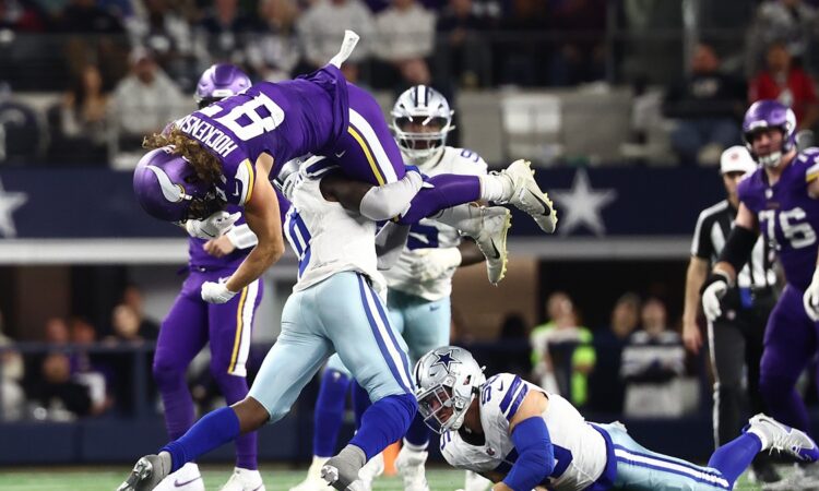 Dallas Cowboys linebacker DeMarvion Overshown flips Minnesota Vikings tight end T.J. Hockenson upside down on a tackle.