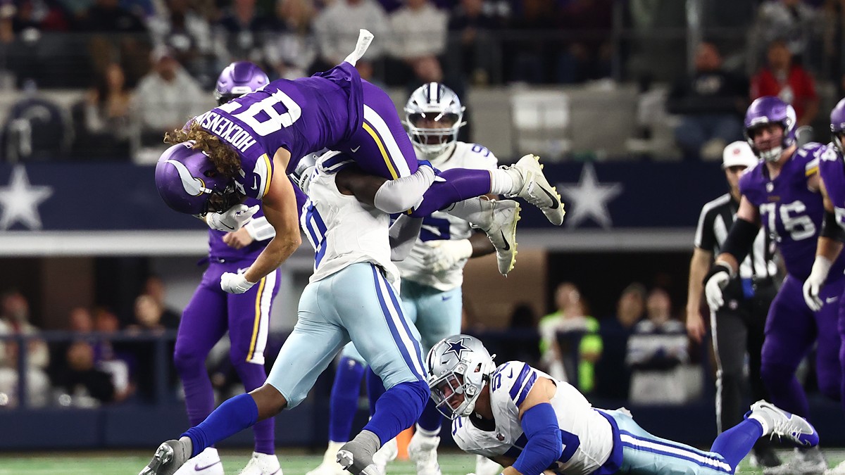 Dallas Cowboys linebacker DeMarvion Overshown flips Minnesota Vikings tight end T.J. Hockenson upside down on a tackle.