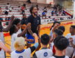 Dallas Mavericks center Dereck Lively II fires up a huddle of young campers at a Mavs Academy hoop camp.