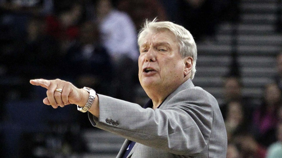 Golden State Warriors head coach Don Nelson points and calls out an instruction to his team from the sideline.