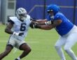 Dallas Cowboys outside linebacker Donovan Ezeiruaku fights the hands of Los Angeles Rams offensive tackle Alaric Jackson during a pass-rush rep.