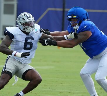 Dallas Cowboys outside linebacker Donovan Ezeiruaku fights the hands of Los Angeles Rams offensive tackle Alaric Jackson during a pass-rush rep.