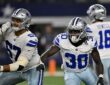 Dallas Cowboys offensive tackle Drew Shelton and running back Israel Abanikanda block in front of the quarterback against the Saints.