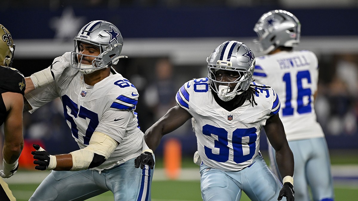 Dallas Cowboys offensive tackle Drew Shelton and running back Israel Abanikanda block in front of the quarterback against the Saints.