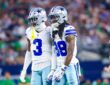 Dallas Cowboys wide receivers George Pickens and CeeDee Lamb stand shoulder to shoulder reacting during a game against the Eagles.