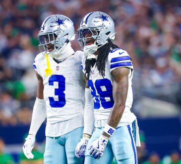 Dallas Cowboys wide receivers George Pickens and CeeDee Lamb stand shoulder to shoulder reacting during a game against the Eagles.