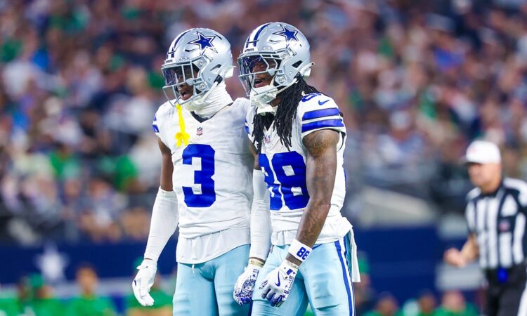 Dallas Cowboys wide receivers George Pickens and CeeDee Lamb stand shoulder to shoulder reacting during a game against the Eagles.
