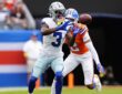 Dallas Cowboys wide receiver George Pickens hauls in a catch as Broncos cornerback Patrick Surtain II defends.