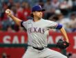 Rangers pitcher Jacob deGrom reaches back to deliver a pitch against the Angels