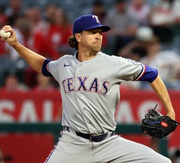 Rangers pitcher Jacob deGrom reaches back to deliver a pitch against the Angels