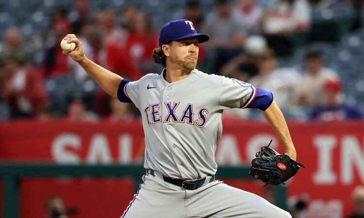 Rangers pitcher Jacob deGrom reaches back to deliver a pitch against the Angels