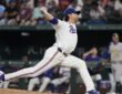 Texas Rangers pitcher Jacob deGrom drives toward the plate in his delivery at Globe Life Field.