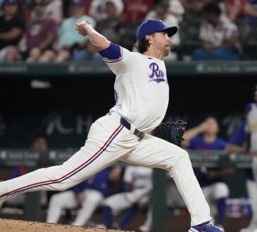 Texas Rangers pitcher Jacob deGrom drives toward the plate in his delivery at Globe Life Field.