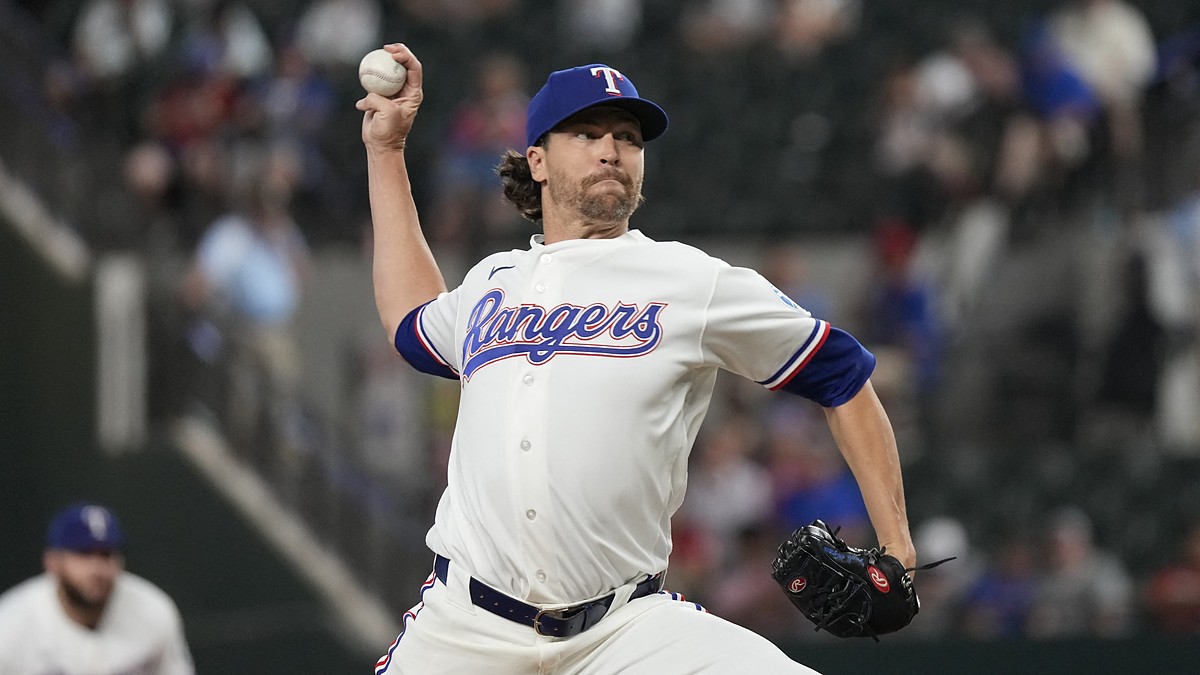Texas Rangers starting pitcher Jacob deGrom releases a pitch in his white home uniform at Globe Life Field.