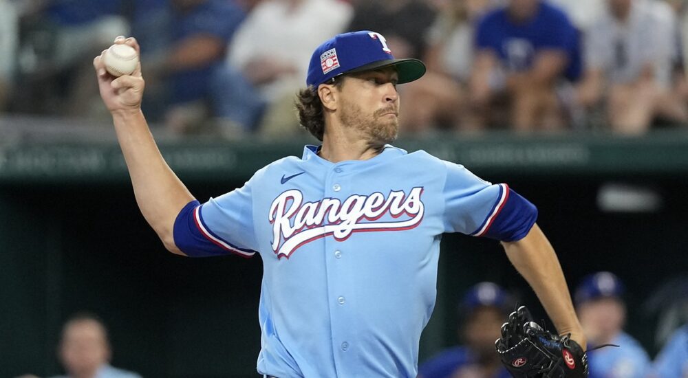 Texas Rangers starting pitcher Jacob deGrom rears back to throw in the powder blue Sunday jersey.