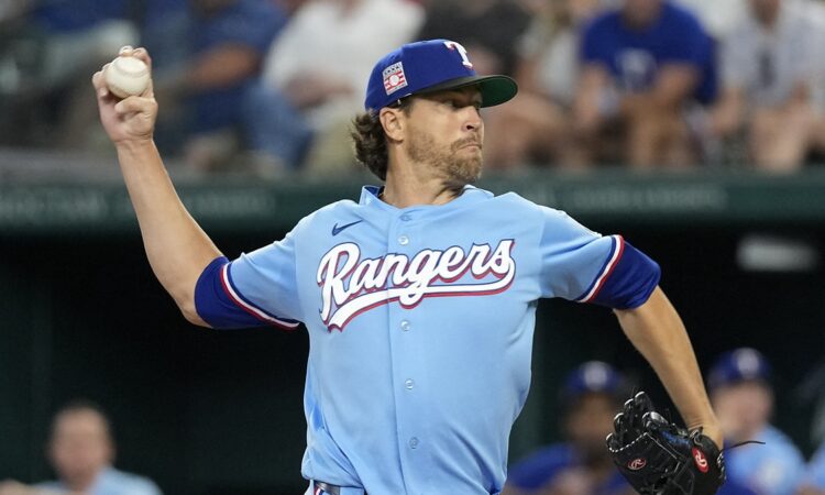 Texas Rangers starting pitcher Jacob deGrom rears back to throw in the powder blue Sunday jersey.