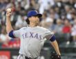 Texas Rangers pitcher Jacob deGrom delivers a pitch in his windup against the Chicago White Sox.