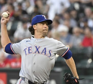 Texas Rangers pitcher Jacob deGrom delivers a pitch in his windup against the Chicago White Sox.