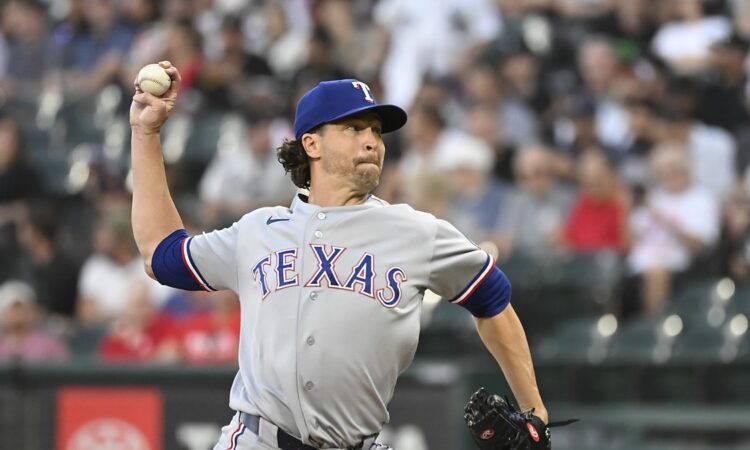 Texas Rangers pitcher Jacob deGrom delivers a pitch in his windup against the Chicago White Sox.