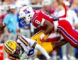 Louisiana Tech defensive back Jacob Fields dives into LSU wide receiver Zavion Thomas, knocking the ball loose.