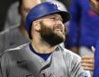 Texas Rangers first baseman Jake Burger smiles in the dugout after a home run against the White Sox.