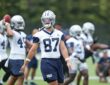 Dallas Cowboys tight end Jake Ferguson walks between reps in his No. 87 practice jersey during minicamp.