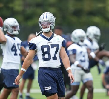 Dallas Cowboys tight end Jake Ferguson walks between reps in his No. 87 practice jersey during minicamp.
