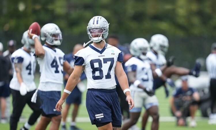 Dallas Cowboys tight end Jake Ferguson walks between reps in his No. 87 practice jersey during minicamp.