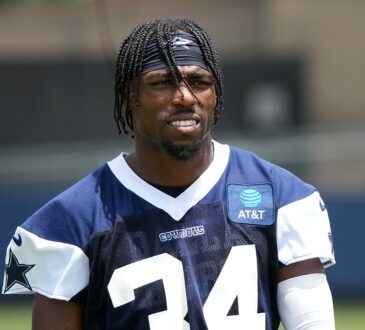 Dallas Cowboys safety Jalen Thompson stands on the practice field in a navy No. 34 practice jersey.