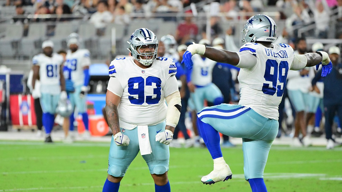 Dallas Cowboys offensive tackle Marcellus Johnson locks up Seattle Seahawks linebacker Aidan Hubbard at the line.