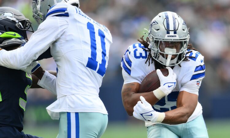 Dallas Cowboys running back Jaydon Blue tucks the ball and cuts upfield against the Seattle Seahawks.