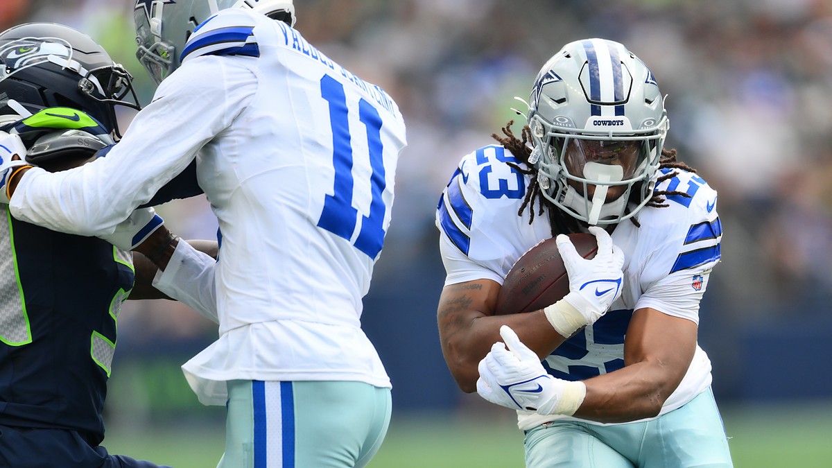 Dallas Cowboys running back Jaydon Blue tucks the ball and cuts upfield against the Seattle Seahawks.