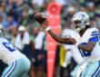 Dallas Cowboys quarterback Joe Milton III cocks the ball to throw as a lineman blocks in front of him.