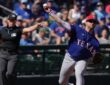 Rangers infielder Jonah Bride throws across the diamond as an umpire signals in the background
