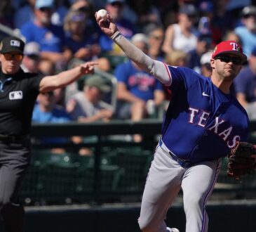 Rangers infielder Jonah Bride throws across the diamond as an umpire signals in the background