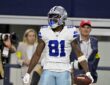 Dallas Cowboys wide receiver Jonathan Mingo celebrates with the ball after a first-down catch at AT&T Stadium.