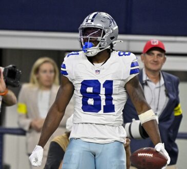 Dallas Cowboys wide receiver Jonathan Mingo celebrates with the ball after a first-down catch at AT&T Stadium.