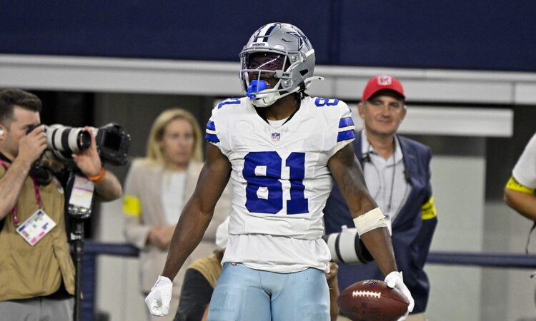 Dallas Cowboys wide receiver Jonathan Mingo celebrates with the ball after a first-down catch at AT&T Stadium.