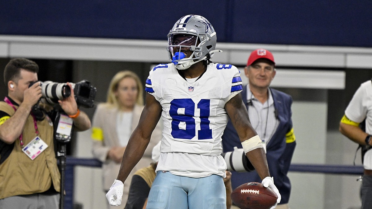 Dallas Cowboys wide receiver Jonathan Mingo celebrates with the ball after a first-down catch at AT&T Stadium.