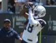 Dallas Cowboys wide receiver Jordan Hudson reaches up to catch a pass during a training camp practice.