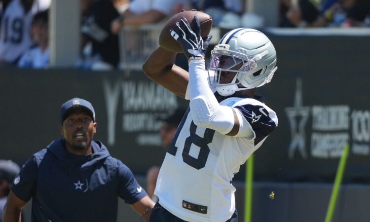 Dallas Cowboys wide receiver Jordan Hudson reaches up to catch a pass during a training camp practice.