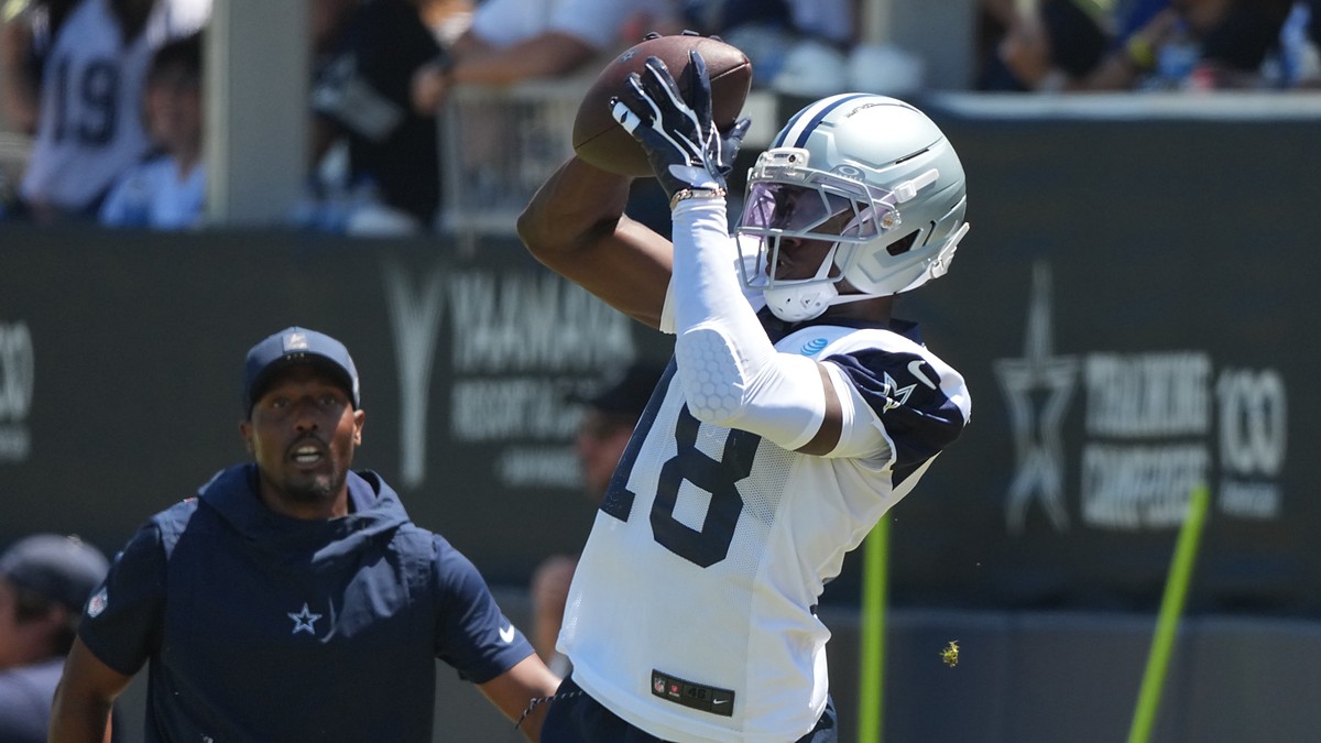 Dallas Cowboys wide receiver Jordan Hudson reaches up to catch a pass during a training camp practice.