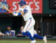 Texas Rangers third baseman Josh Jung follows through on a single against the Chicago White Sox at Globe Life Field.
