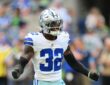Dallas Cowboys safety Julius Wood shouts in celebration after a special teams play at Lumen Field