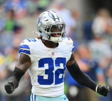 Dallas Cowboys safety Julius Wood shouts in celebration after a special teams play at Lumen Field