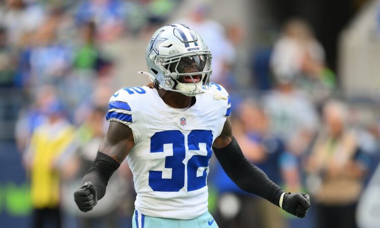 Dallas Cowboys safety Julius Wood shouts in celebration after a special teams play at Lumen Field