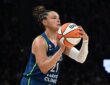 Lynx guard Kayla McBride sets her feet and rises into a three-point shot against the Wings