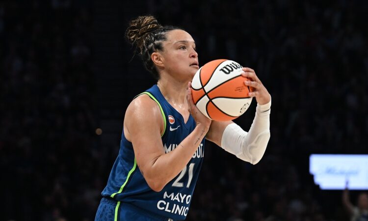 Lynx guard Kayla McBride sets her feet and rises into a three-point shot against the Wings