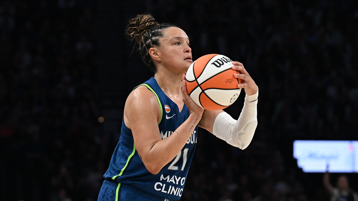 Lynx guard Kayla McBride sets her feet and rises into a three-point shot against the Wings